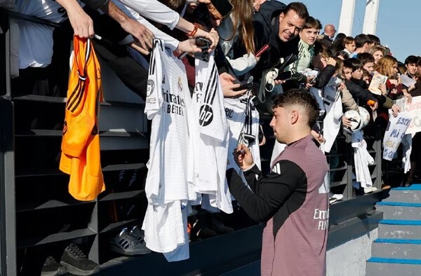 Young Real Madrid fans celebrate at open training session
